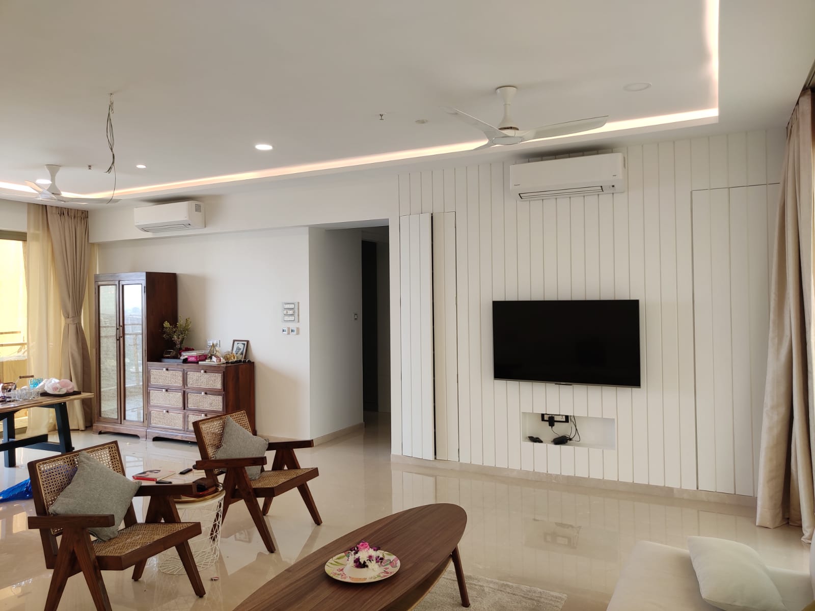 Modern beige living room with white sectional sofa